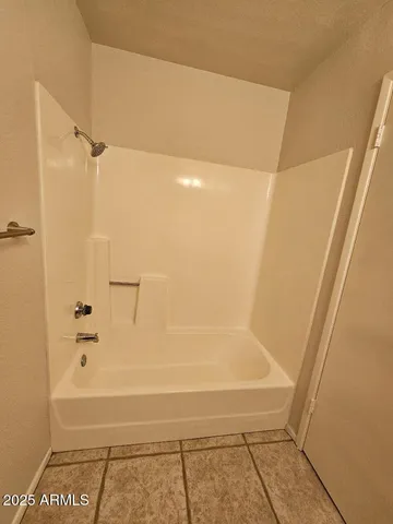 a bathroom with a toilet sink vanity and mirror