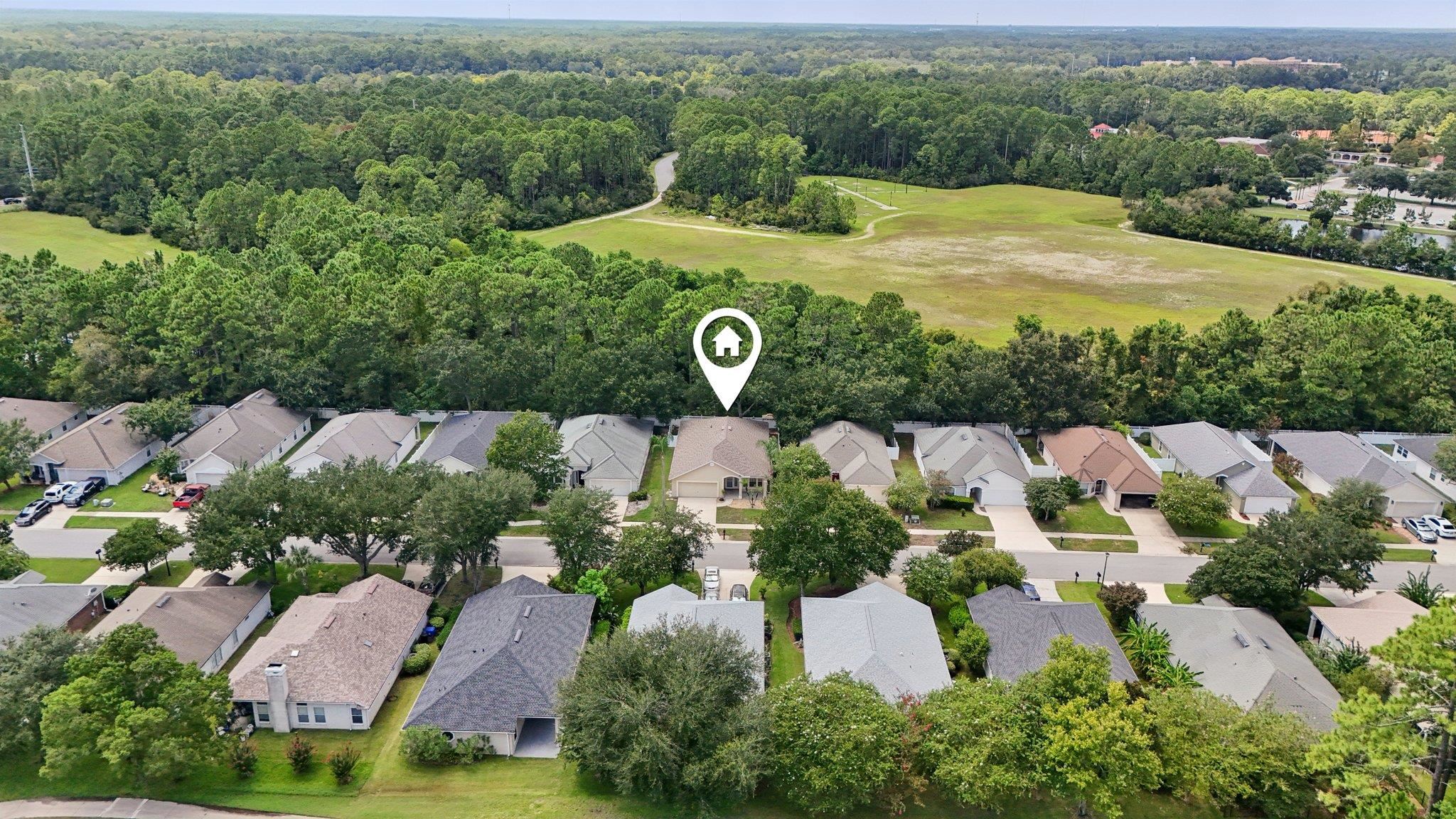 1821 Keswick Road St. Augustine, FL 32084 - Photo 1 of 57 an aerial view of a house with garden space and street view