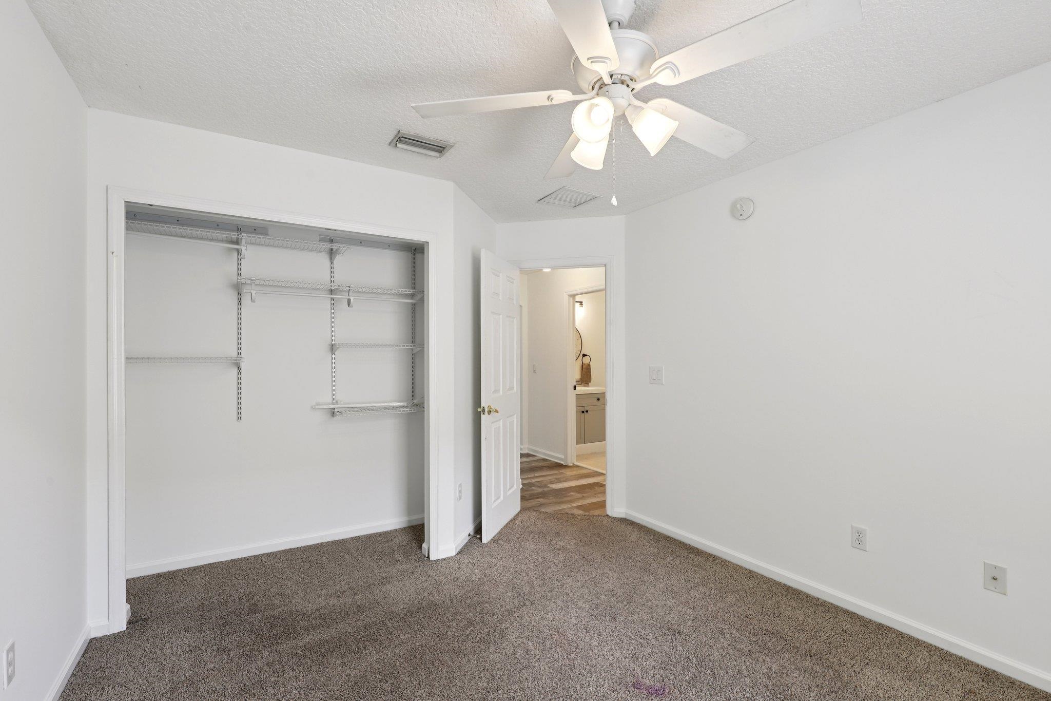 1821 Keswick Road St. Augustine, FL 32084 - Photo 26 of 57 an empty room with a ceiling fan and a ceiling fan