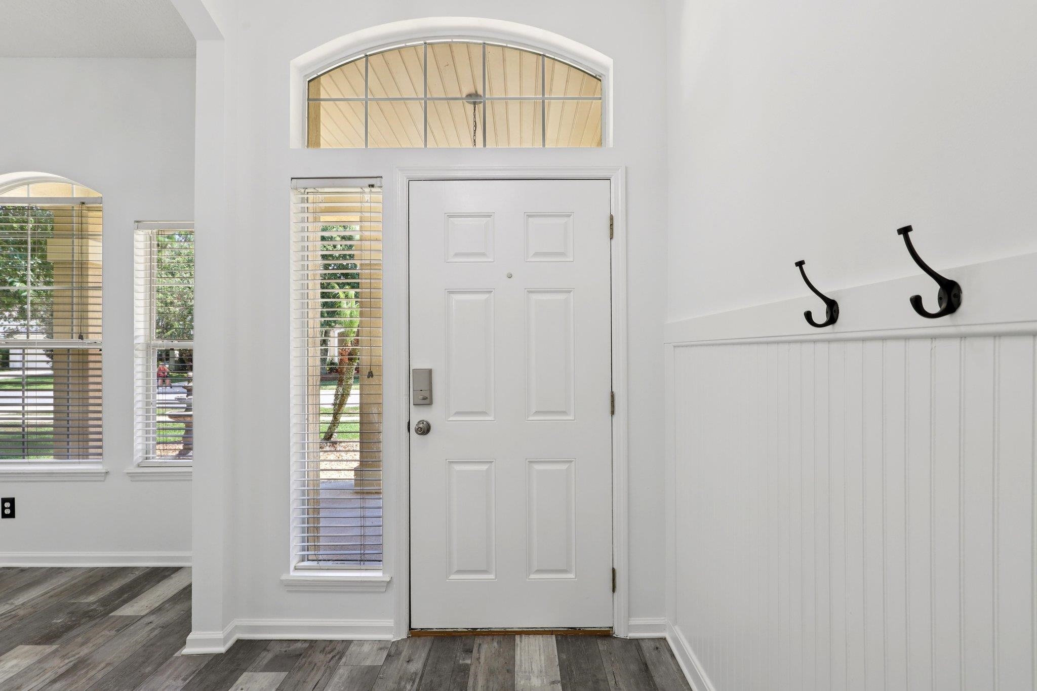 1821 Keswick Road St. Augustine, FL 32084 - Photo 3 of 57 Foyer entrance with dark wood-style floors and baseboards