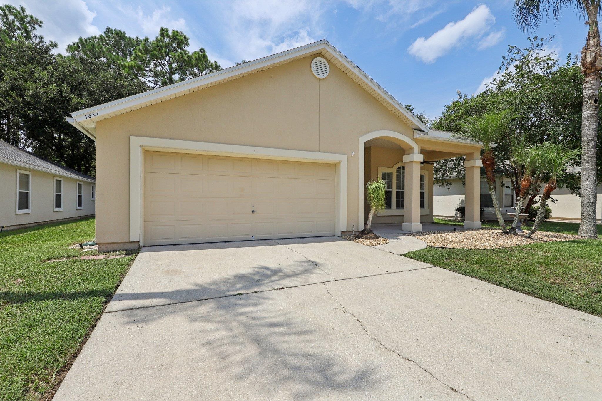 1821 Keswick Road St. Augustine, FL 32084 - Photo 49 of 57 a view of a house with a yard