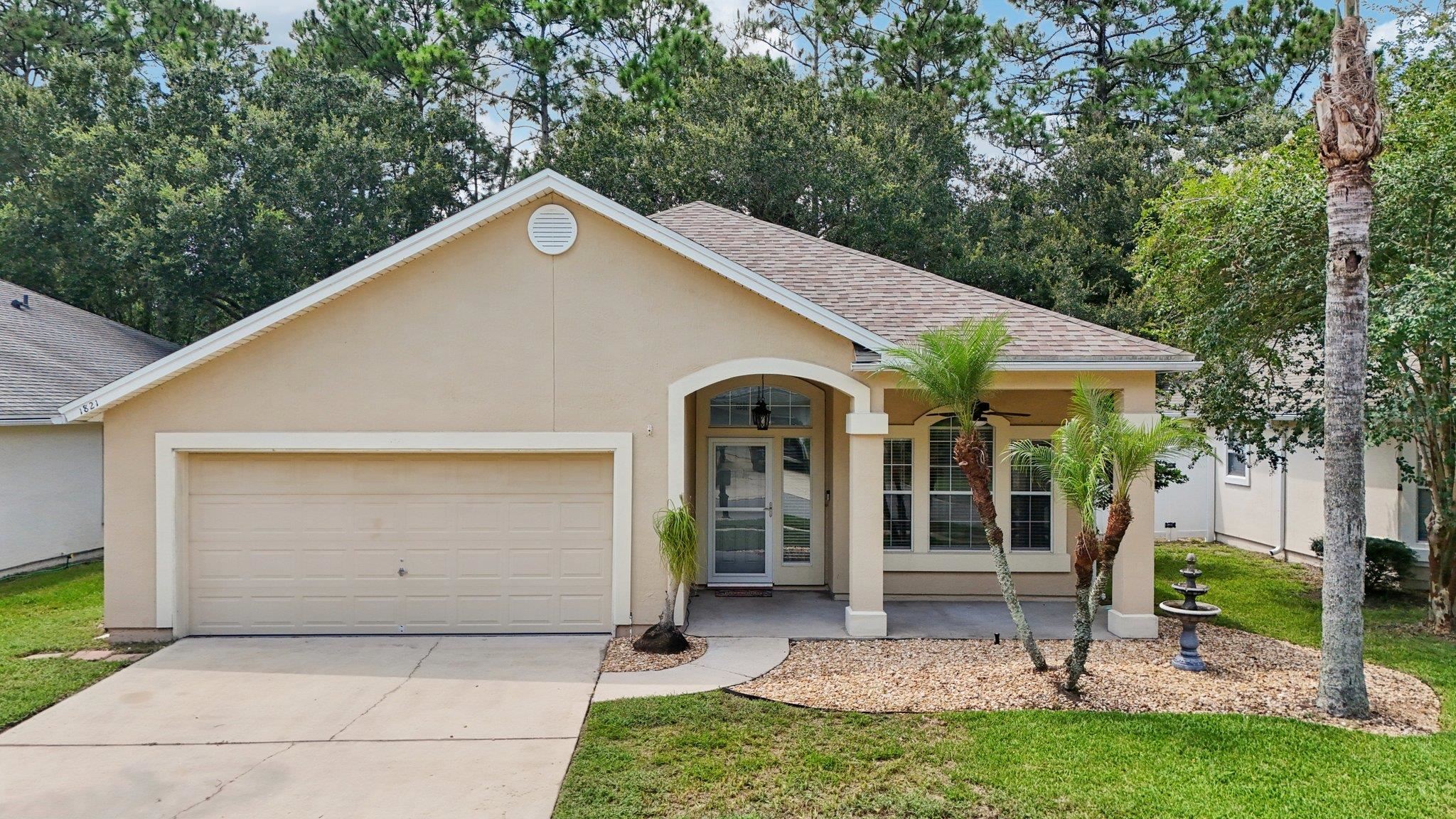 1821 Keswick Road St. Augustine, FL 32084 - Photo 8 of 57 a view of a house with a yard and large tree