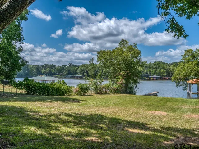 a view of a garden with a building in the background