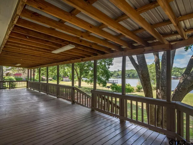 a view of porch with wooden floor