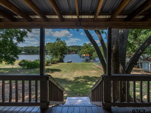 a view of a balcony with wooden floor