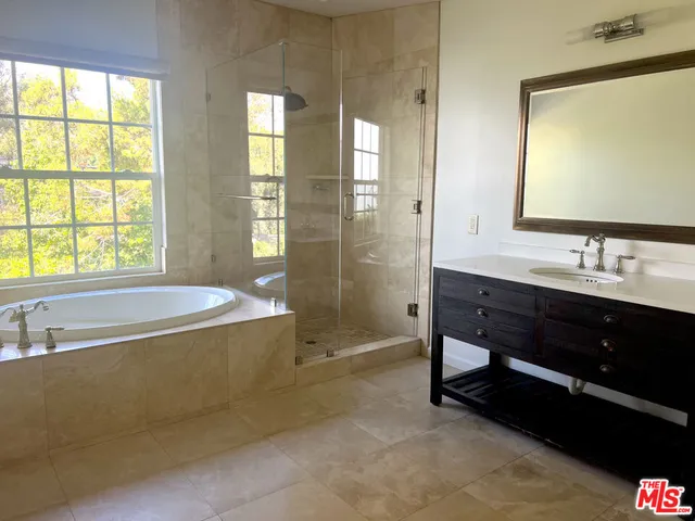 a bathroom with a bathtub and a sink