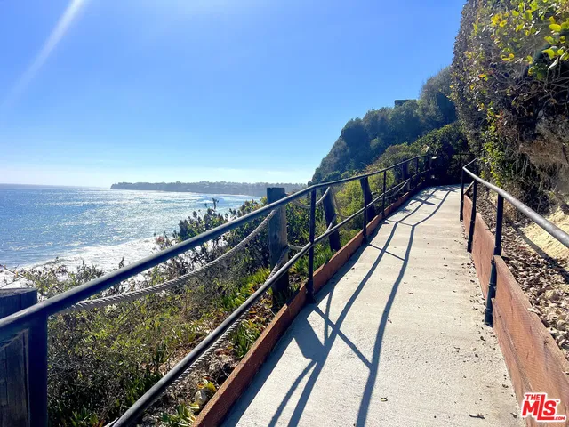 a view of a balcony with ocean view