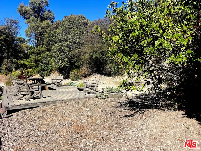 a view of a yard with snow on the road