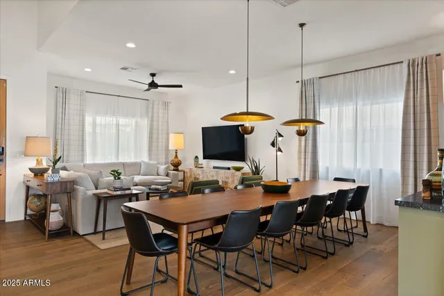 a kitchen with stainless steel appliances granite countertop a sink a stove and a refrigerator