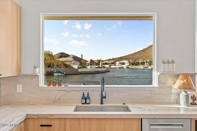 a balcony with wooden floor and city view