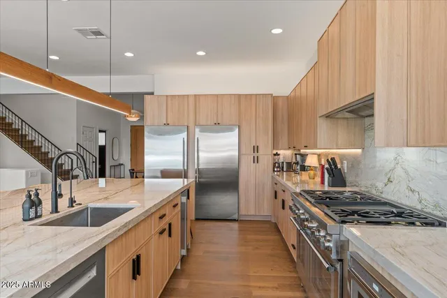 a bedroom with a balcony a bed and a television