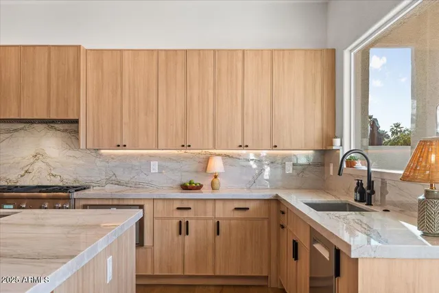a bedroom with a bed and painting on the wall