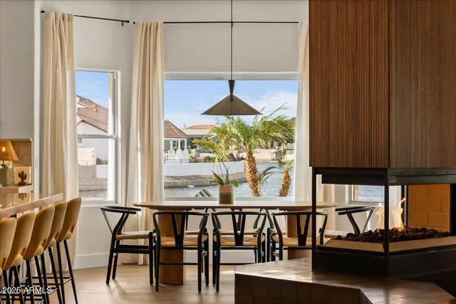 a bedroom with two beds and painting on the wall