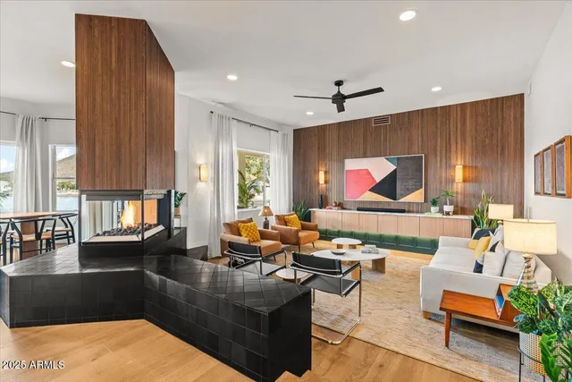 a bedroom with a bed and painting on the wall