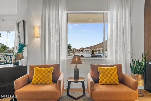 a bedroom with furniture and a lamp