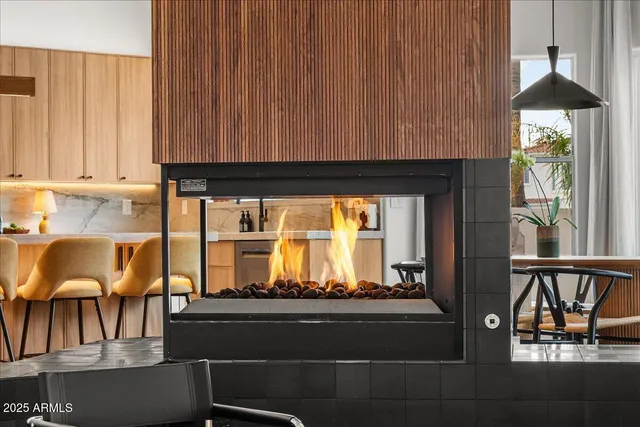 a bedroom with a large bed and a large window