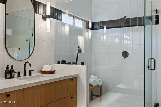 a view of a patio with table and chairs under an umbrella