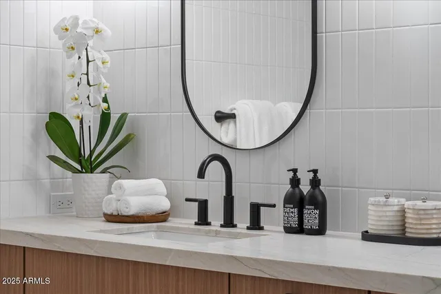a view of a roof deck with chair and wooden floor