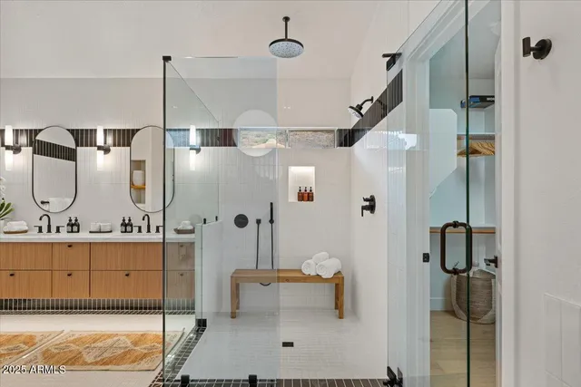 a front view of a house with garden and sitting area