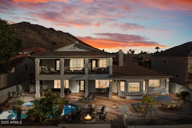 a view of a a dining room with furniture window and wooden floor