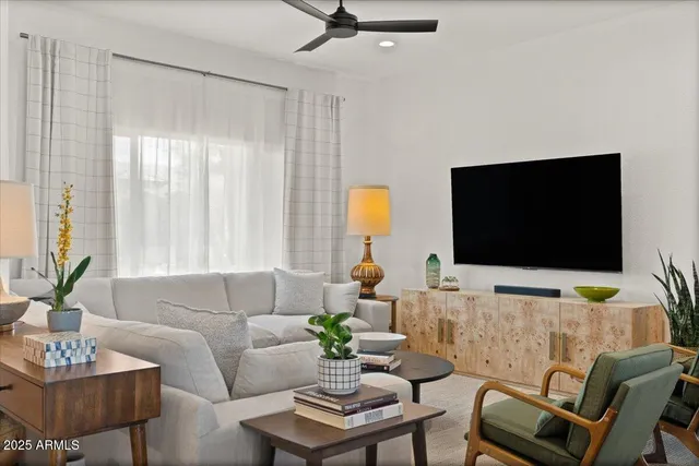 a view of a dining room with furniture and a mirror