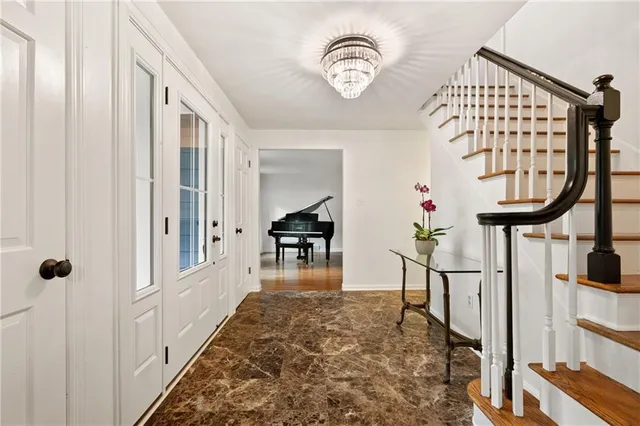 a view of entryway with wooden floor