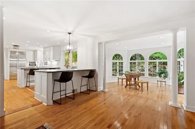 a living room with furniture a window and appliances