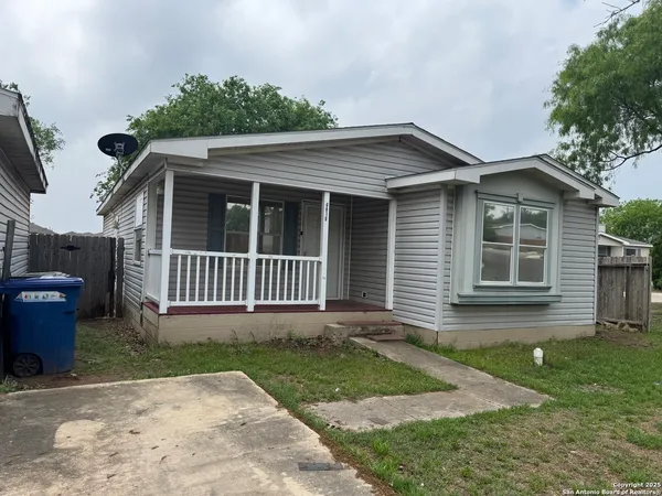 a view of a house with a yard and a garden