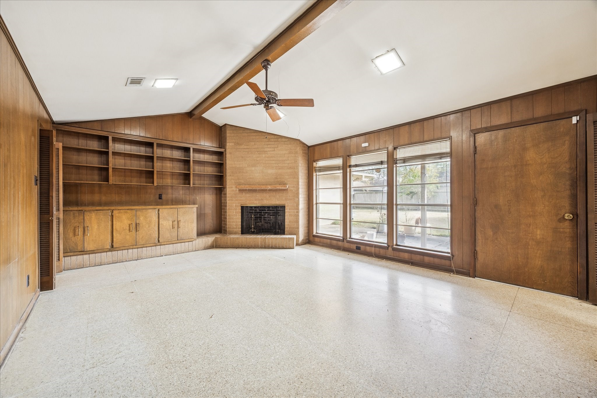 5751 Jason Street Houston, TX 77096 - Photo 6 of 19 view of the family room from the kitchen. Note all the built ins, the fireplace and high ceilings...