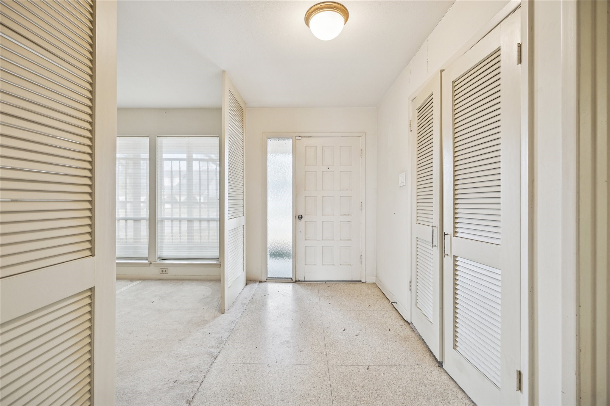 5751 Jason Street Houston, TX 77096 - Photo 8 of 19 Entry with terrazo and to the left is the Livingroom and Diningroom