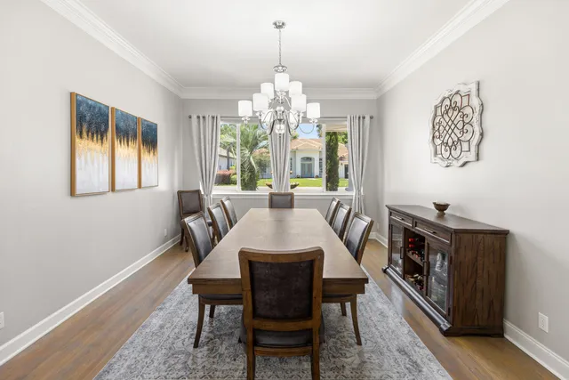a kitchen with a white cabinets sink and stove