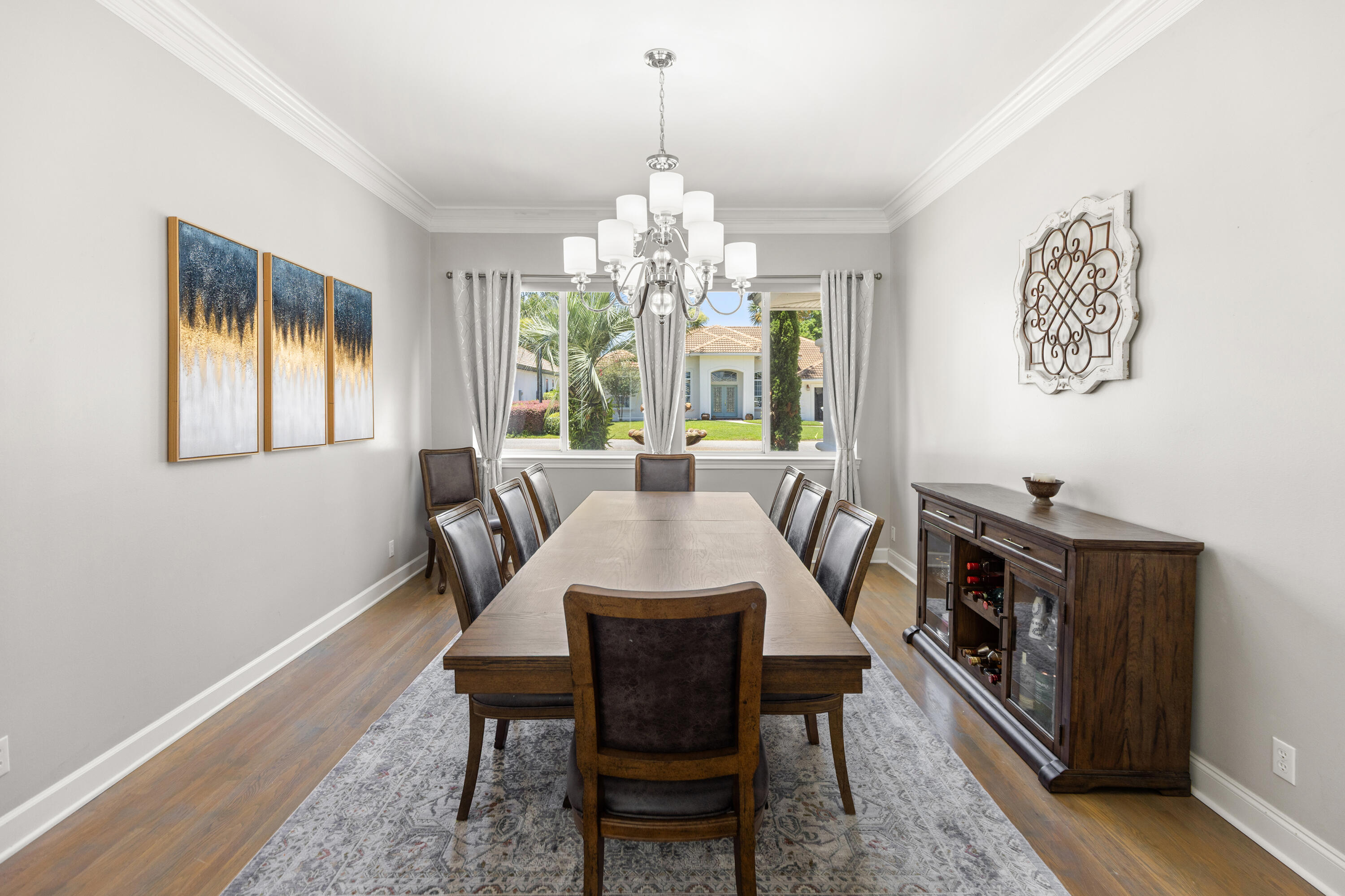 96 Garnet Place Destin, FL 32541 - Photo 12 of 90 a view of a dining room with furniture a chandelier and wooden floor