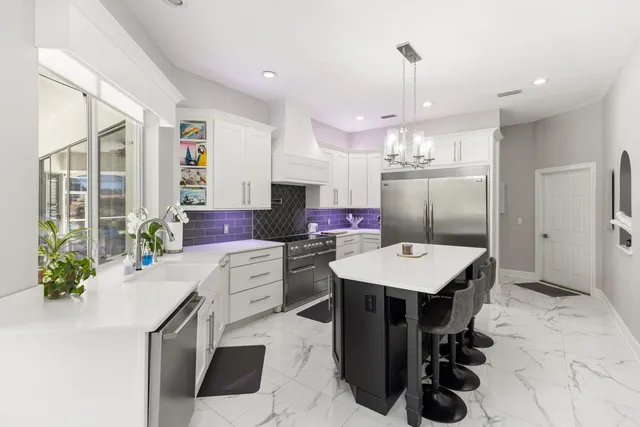 a living room with furniture ceiling fan and a rug