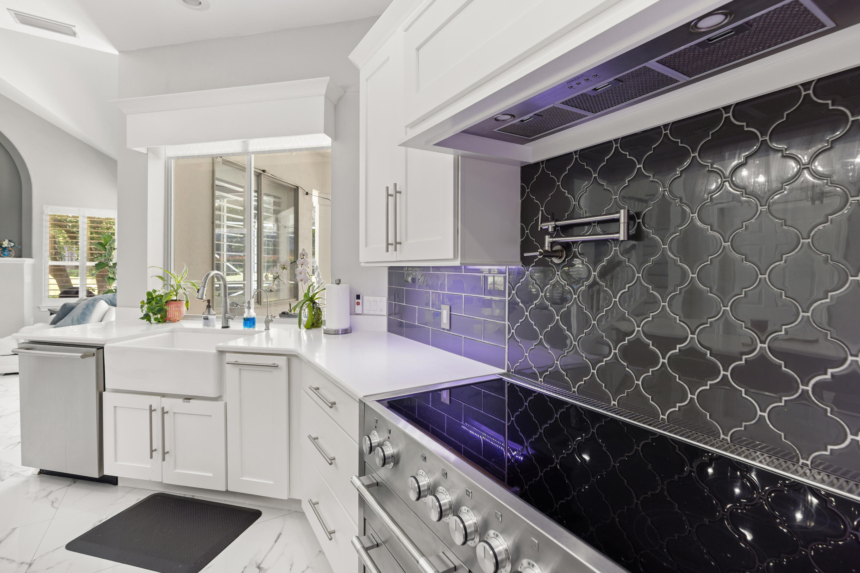 96 Garnet Place Destin, FL 32541 - Photo 17 of 90 a kitchen with a sink stove and cabinets