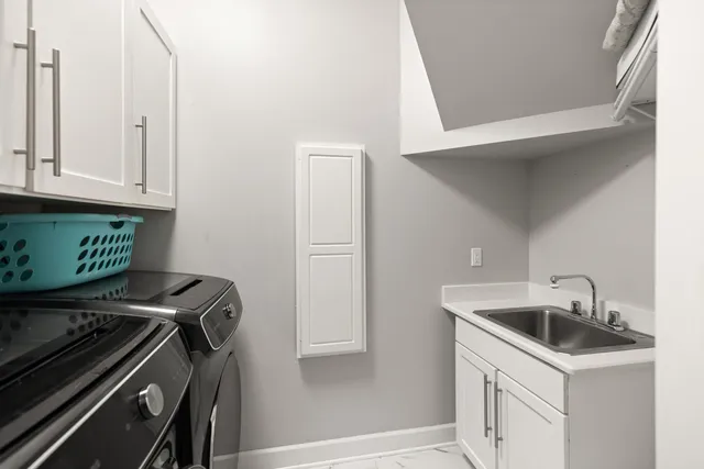 a view of a livingroom with furniture and a window