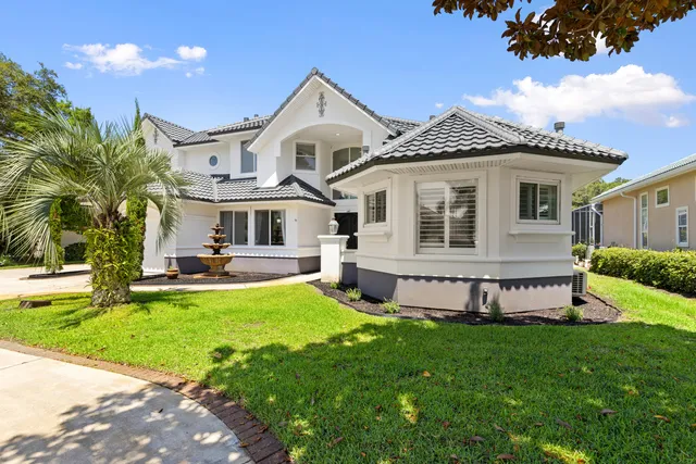 a view of a house with a yard porch and sitting area