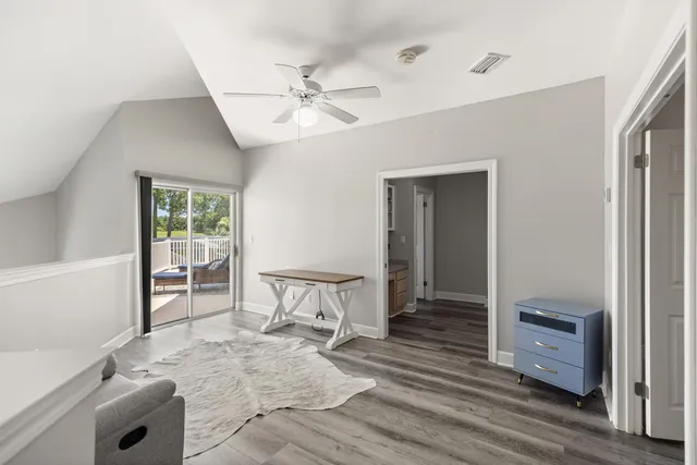 a view of a patio with couches and a table and chairs