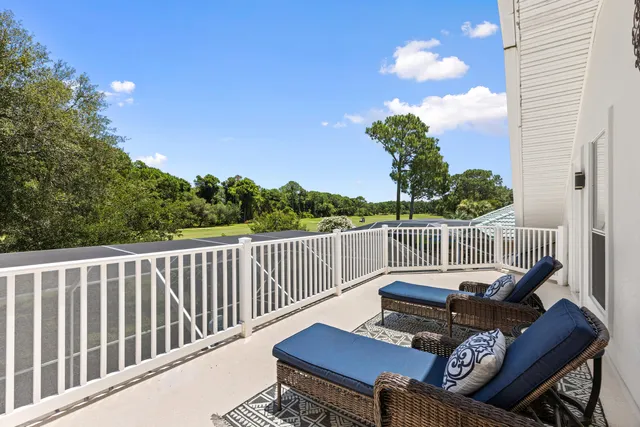 a view of a swimming pool with a outdoor seating