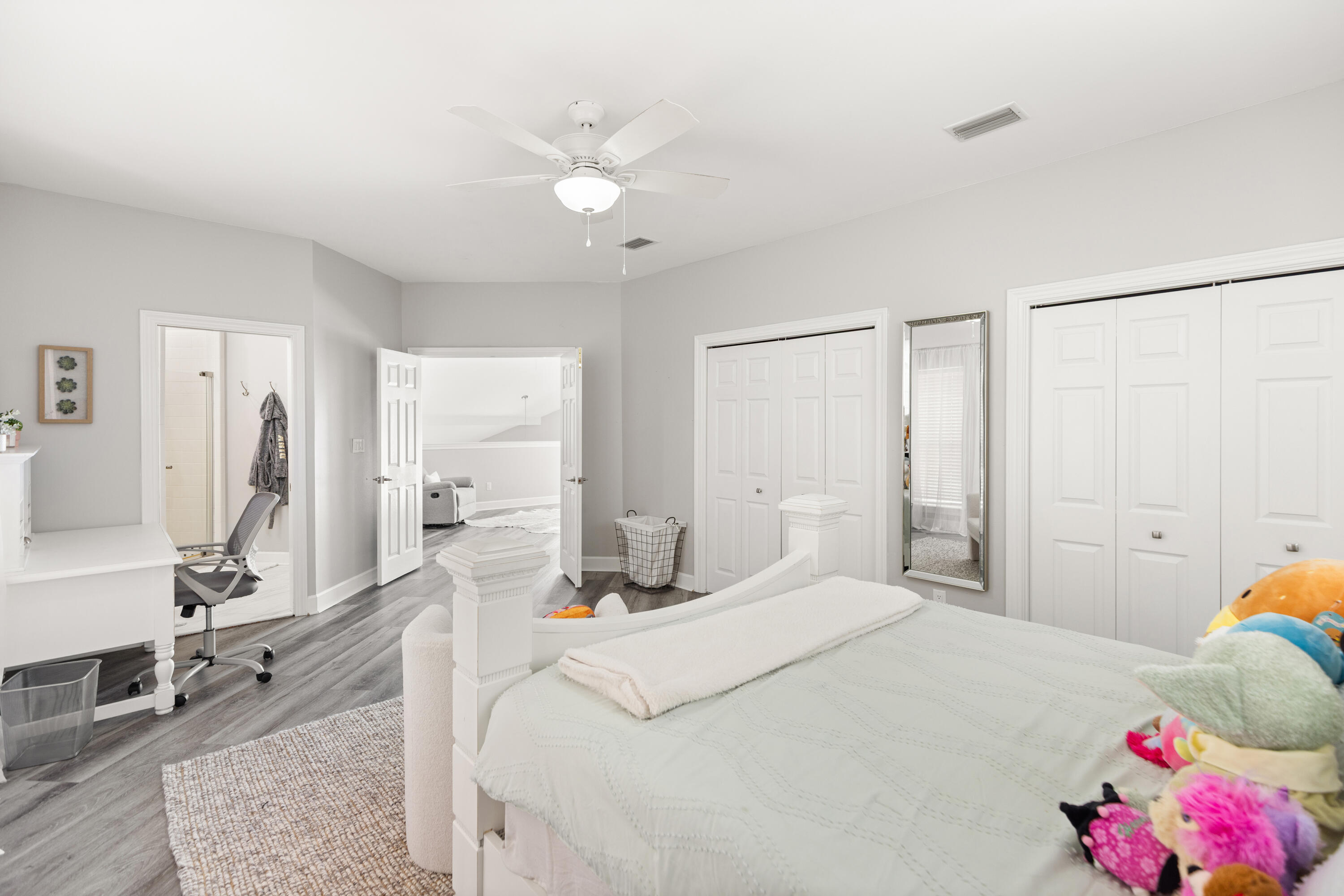 96 Garnet Place Destin, FL 32541 - Photo 42 of 90 a bedroom with a bed and a chandelier