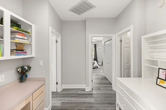 a dining room with furniture a fireplace and a chandelier