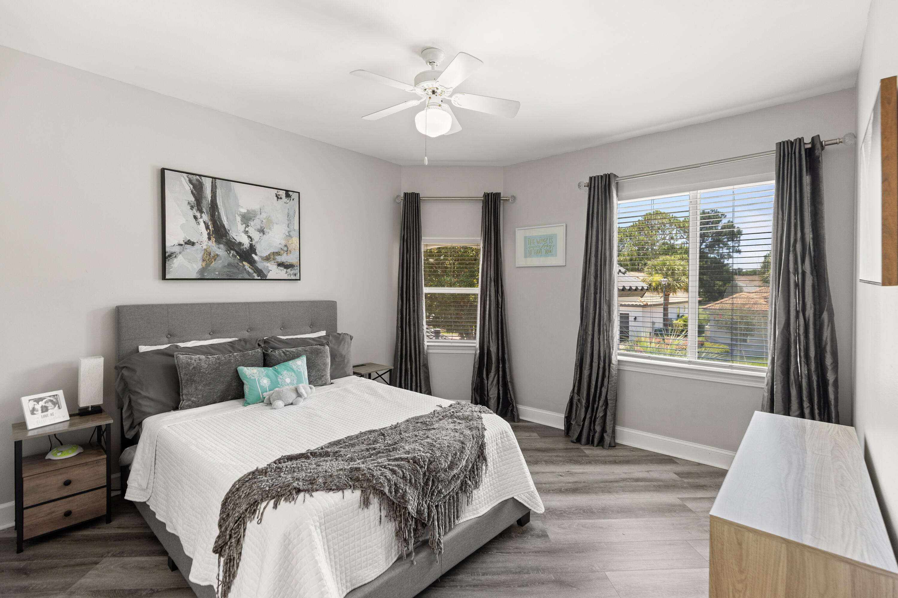 96 Garnet Place Destin, FL 32541 - Photo 48 of 90 a bedroom with a large bed and a chandelier