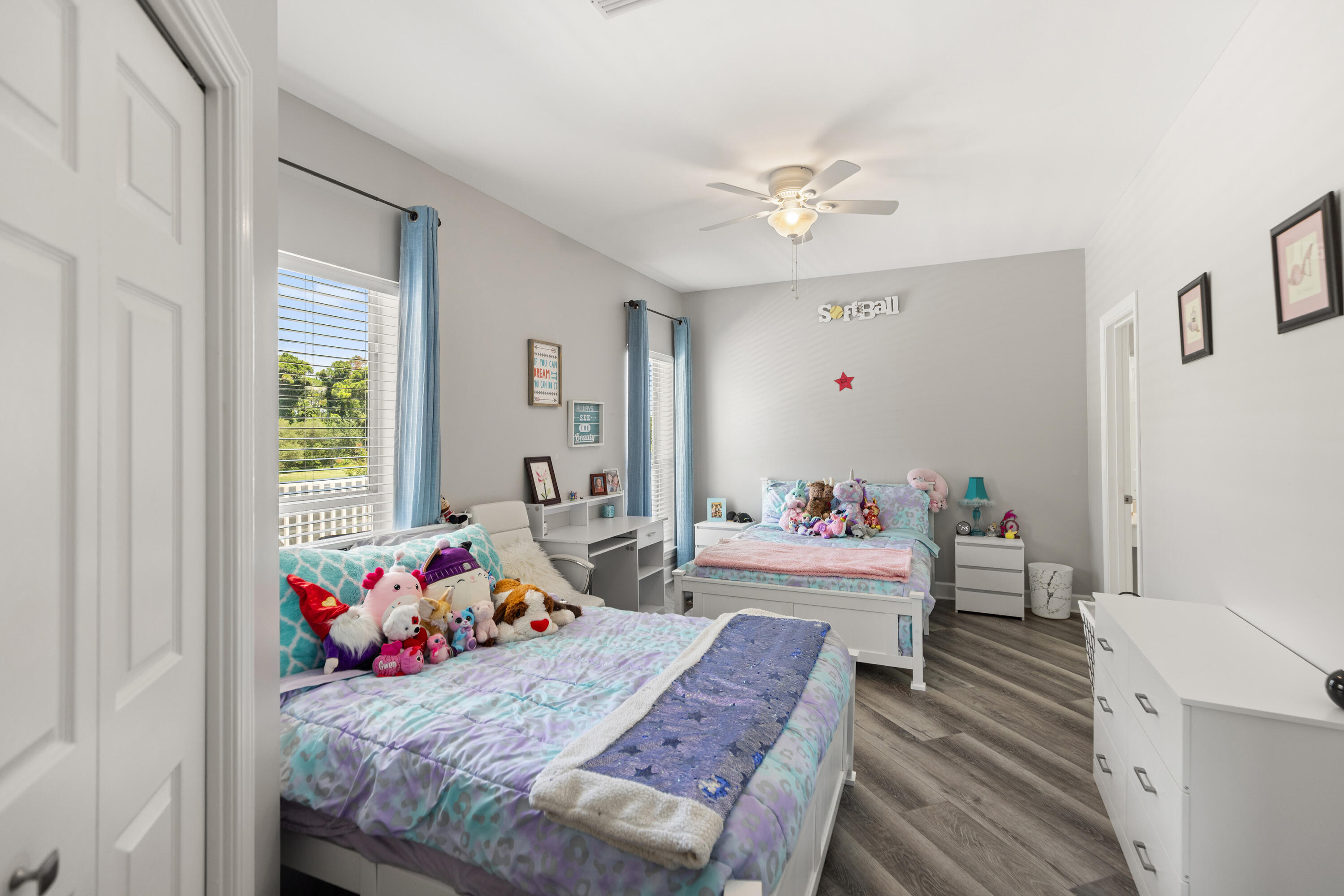 96 Garnet Place Destin, FL 32541 - Photo 50 of 90 a bedroom with a bed and a chandelier