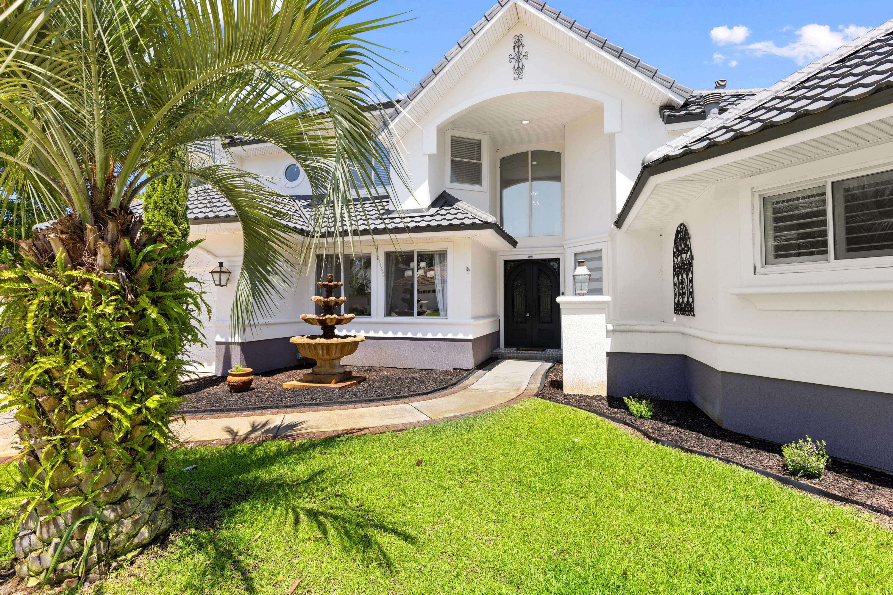 96 Garnet Place Destin, FL 32541 - Photo 6 of 90 a front view of a house with a yard