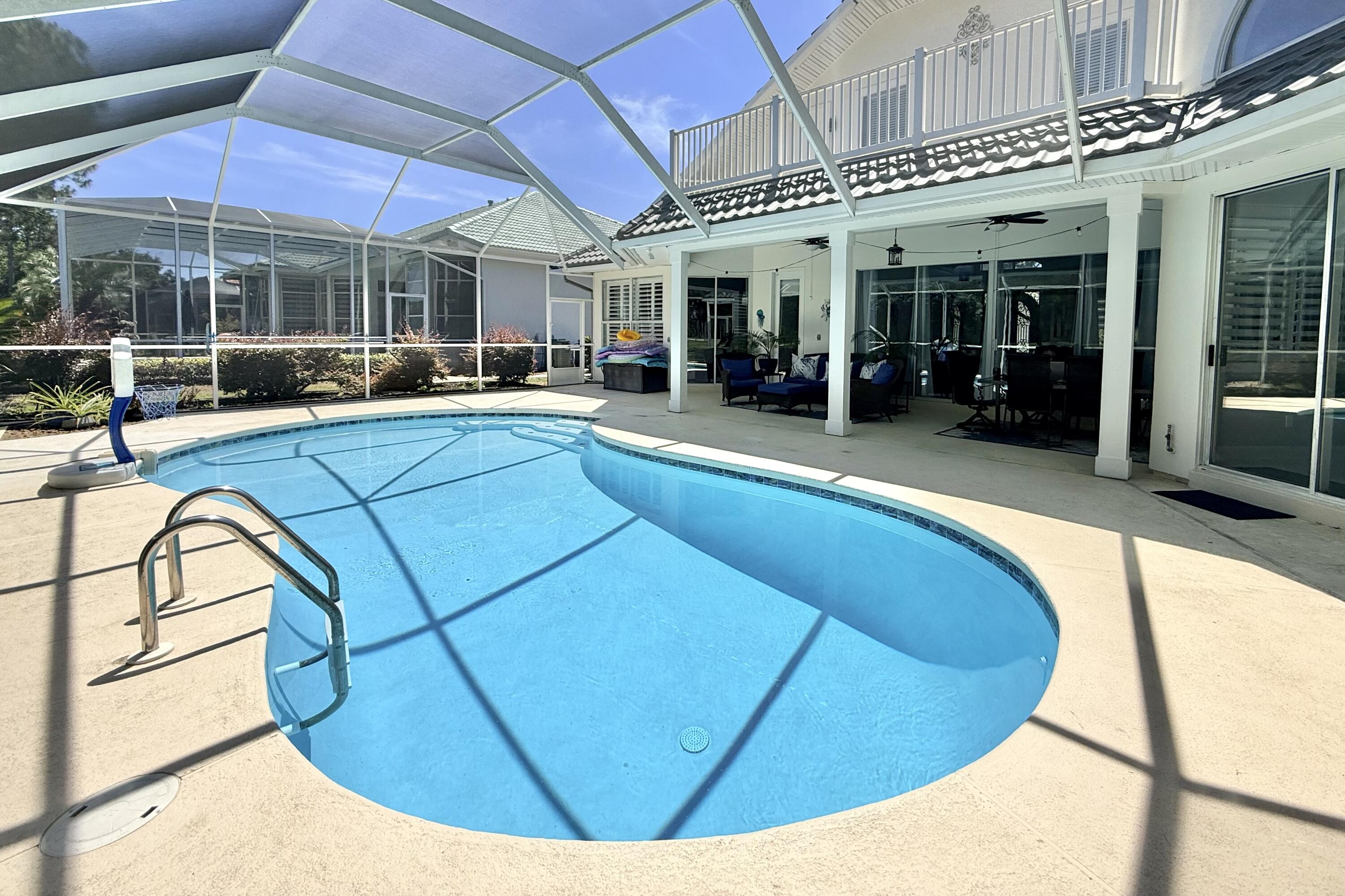 96 Garnet Place Destin, FL 32541 - Photo 65 of 90 a view of a swimming pool with a patio