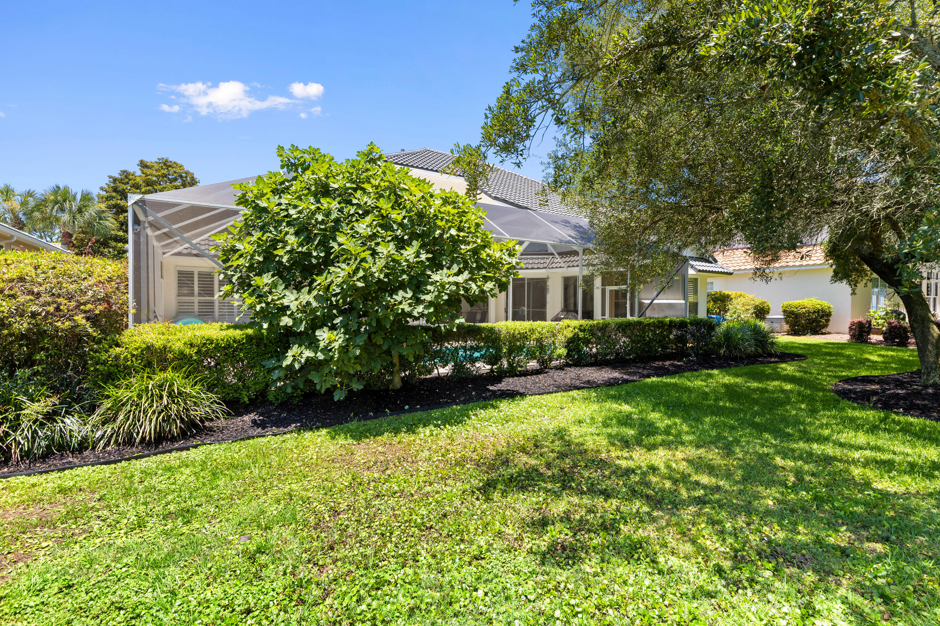 96 Garnet Place Destin, FL 32541 - Photo 69 of 90 a view of a house with a big yard and potted plants