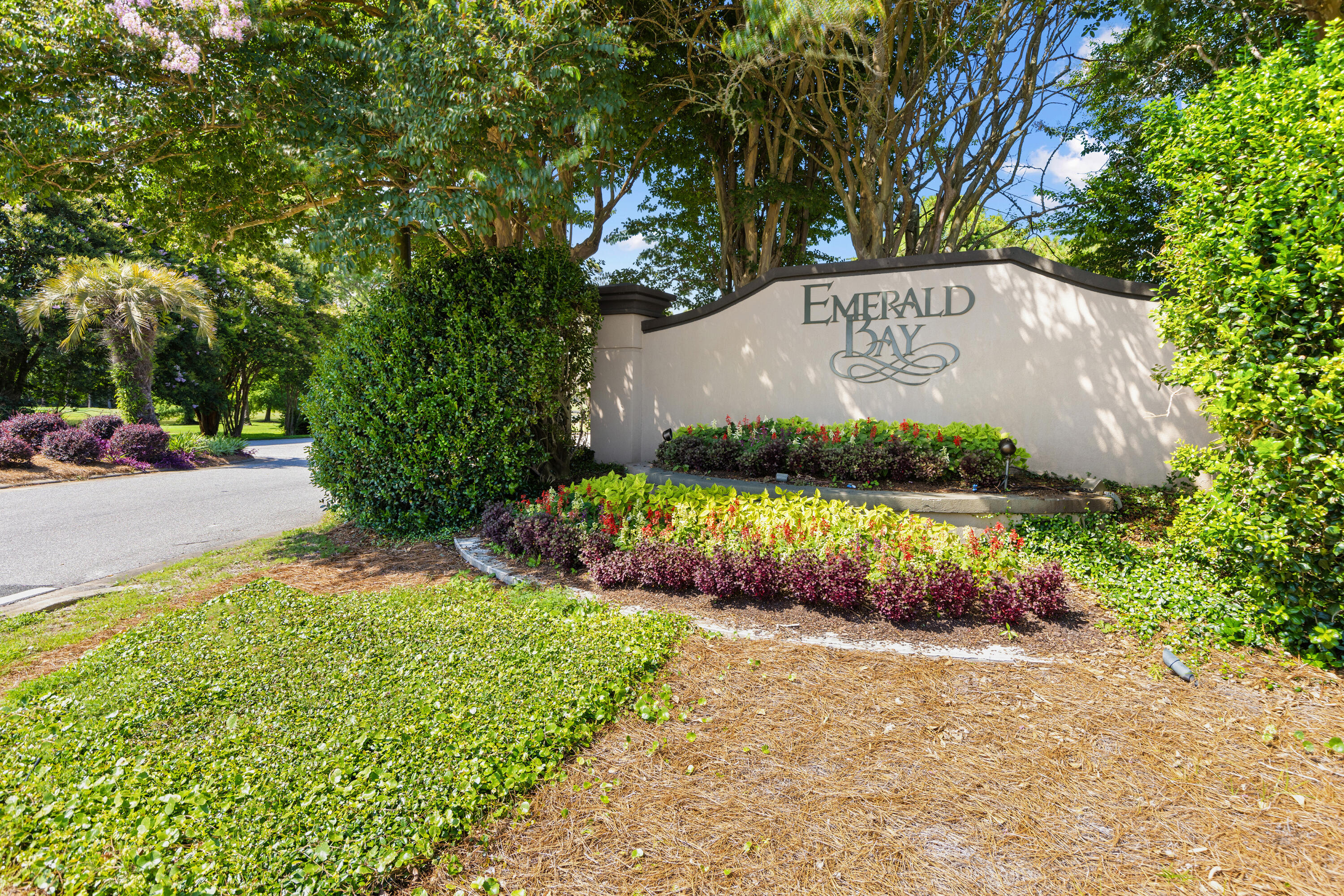 96 Garnet Place Destin, FL 32541 - Photo 78 of 90 a view of outdoor space with signage and flags
