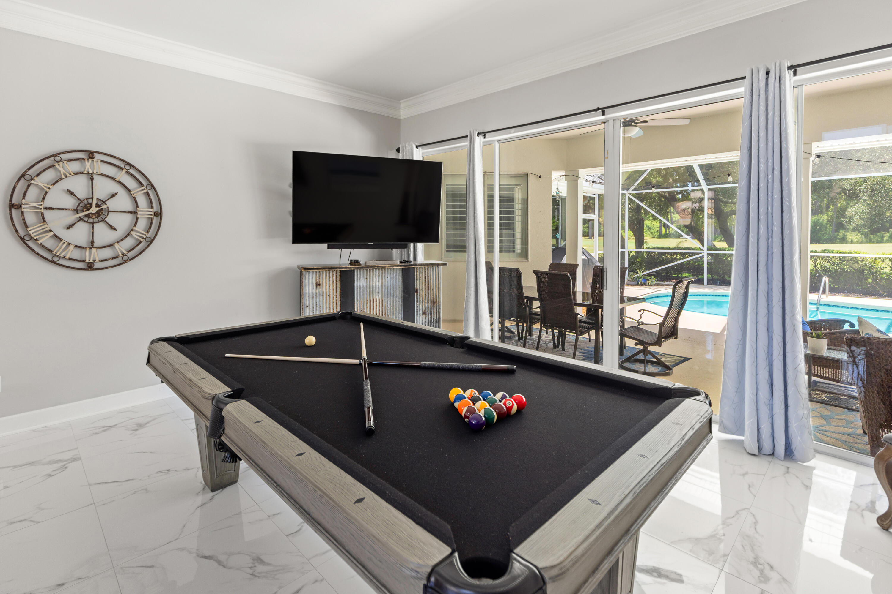 96 Garnet Place Destin, FL 32541 - Photo 9 of 90 a living room with a flat screen tv and a floor to ceiling window