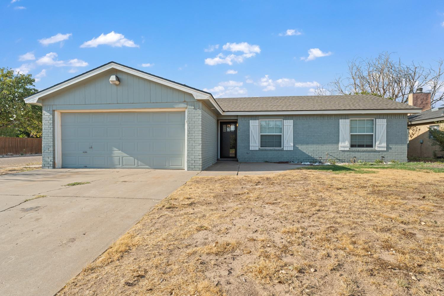 6154 38th Street Lubbock, TX 79407 - Photo 1 of 23 a view of a house with a yard