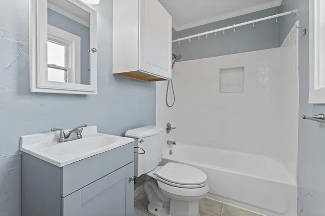 a bathroom with a sink toilet and bathtub