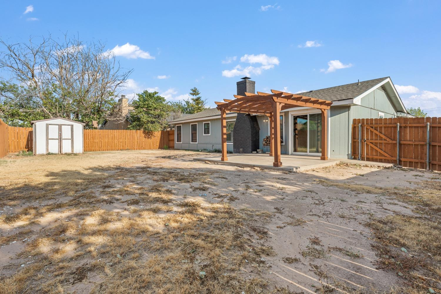 6154 38th Street Lubbock, TX 79407 - Photo 22 of 23 a front view of a house with a yard